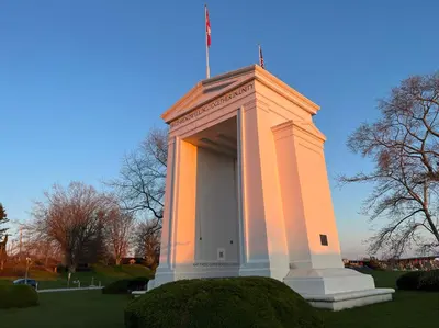 a tall building with a flag on top of it at JESI'S NEW HOUSE, Self Enter 2BR, Whole Suite, Close to White Rock Beach & US Border in Surrey