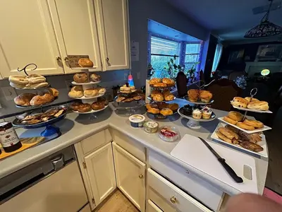 a counter with many different types of pastries on it at B&B In Fraser Valley in Abbotsford