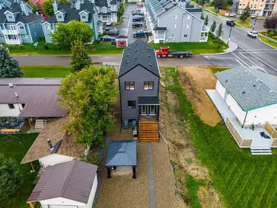 an aerial view of a house in a residential neighborhood at The Promenade I Patio and BBQ I Fire pit I Sleep 9 in Sylvan Lake
