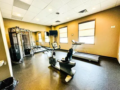 a gym with two exercise bikes in a room at Beaverlodge Motor Inn in Beaverlodge