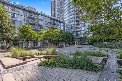 a courtyard in a city with tall buildings at Gastown Downtown Apartment very central in Vancouver