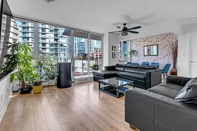 a living room with a couch and a table at Gastown Downtown Apartment very central in Vancouver