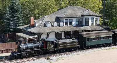 a model train in front of a house at Stunning Modern Suite - King Bed - Free Parking & Netflix - Fast Wi-Fi - Long Stays Welcome in Edmonton