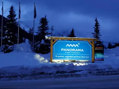 a sign for the pantomima ski resort in the snow at The Powder Nook, Hot Pools, Mile 1 Express Chair in Panorama