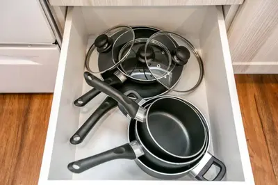 a bunch of pots and pans in a drawer at Steamy Romantic Greek Corneer Suite King U/G Wifi in Edmonton