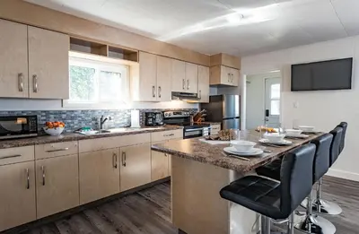 a kitchen with a large island in the middle at Downie Cottage by Revelstoke Vacations in Revelstoke