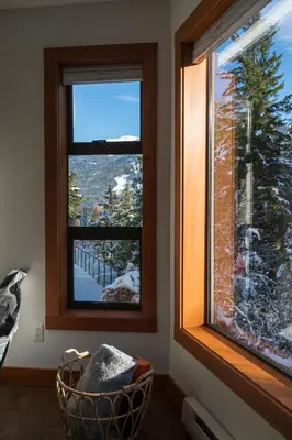 a window with a view of a snow covered tree at 2BR in Greyhawk, Hot Tub and Sauna, Gas Fireplace, Secure Parking in Whistler