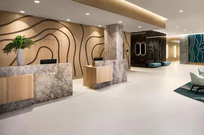 a lobby of a hotel with a reception desk at Delta Hotels by Marriott Vancouver Delta in Delta