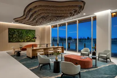a living room with a table and chairs at Delta Hotels by Marriott Vancouver Delta in Delta