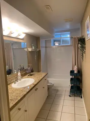 a bathroom with a sink and a toilet at Jimmy B&B in Surrey