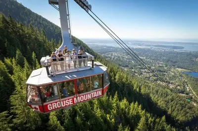 a group of people riding a gondola in the mountains at King Garden Suite/20 mins to Dwntwn Vancouvr/PetOk in North Vancouver