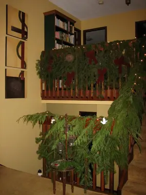 a living room with a christmas tree on a staircase at Misty Meadows B and B in Langford