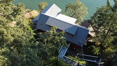 an aerial view of a house with the water at Salishan Chief Suite by EMR Vacation Rentals in Cowichan Bay