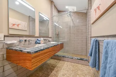 a bathroom with a sink and a shower at Salishan Tree House Suite by EMR Vacation Rentals in Cowichan Bay