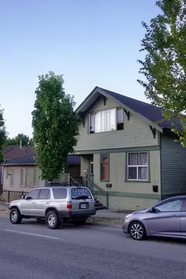 two cars parked in front of a house at Private room in a Shared house in Vancouver