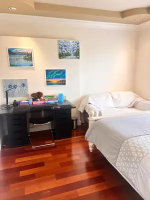 a bedroom with a bed and a desk at Lucky suite, two-bedroom suite with independent entrance in Richmond close to YVR in Richmond