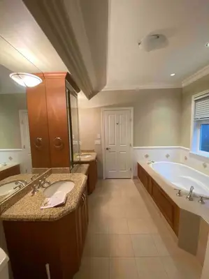 a large bathroom with a tub and a sink at Lucky suite, two-bedroom suite with independent entrance in Richmond close to YVR in Richmond