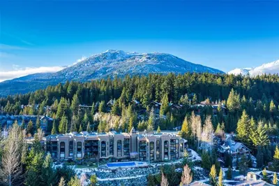 an aerial view of a resort with a mountain in the background at Ironwoods on Blueberry Hill by Whistler Blackcomb Vacation Rentals in Whistler