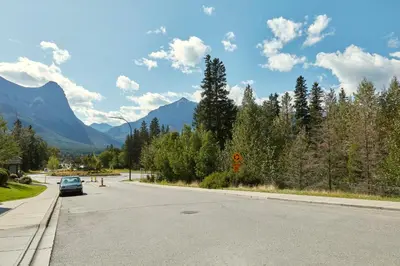 a car parked on the side of a road at Beautiful Renovated Wolf 2Bed 2Bath in Canmore