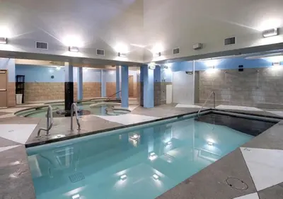 a large swimming pool in a building at Luxury Penthouse At Solar A Resort And Spa in Canmore