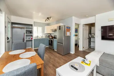 a kitchen and living room with a table and a couch at NN - The Summit - Copper Ridge 1-bed 1-bath in Whitehorse