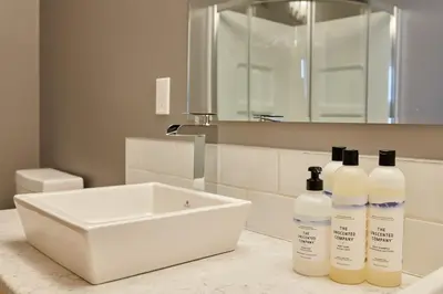 two bottles ofodorizers sitting on a counter in a bathroom at NN - The Kluane - Whistlebend 3-bed 2-bath in Whitehorse