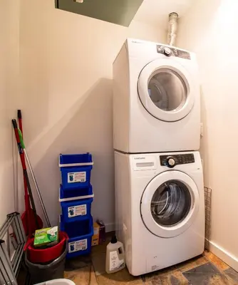 a washing machine and a washer in a room at NN - Park View #2 - Downtown 2-bed 2-bath in Whitehorse