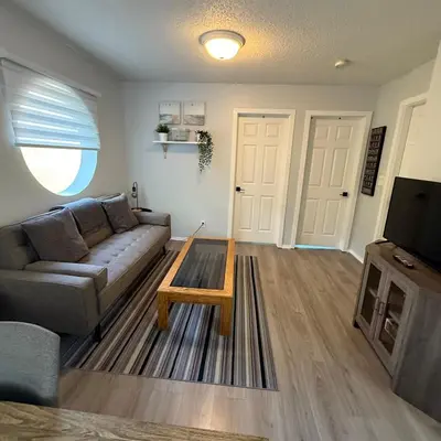 a living room with a couch and a coffee table at Lovely 2 bedroom condo, 2 minute walk fr downtown in Invermere