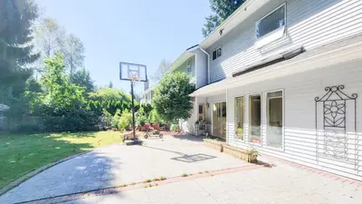 a basketball hoop in front of a house at Ocean Park B&B in Surrey