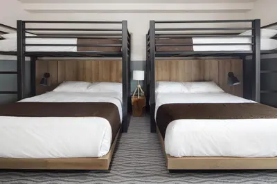 two bunk beds in a hotel room with two beds at The Approach Hotel in Panorama
