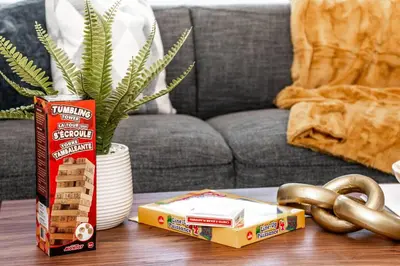 a coffee table with a box of crackers and a book at Nordic Retreat, 4BR, Min to WEM & DT, AirCon & Fireplace, Sleeps 10! in Edmonton