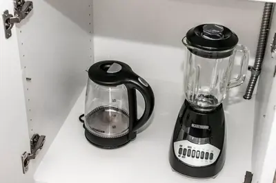 a blender sitting on top of a shelf at Modern Nordic Escape, 3BR Near WEM & DT, AirCon & Fireplace, Wifi, Sleeps 6! in Edmonton