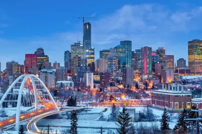 a view of a city skyline at night with lights at Cozy Nordic Utopia, Bsmt Suite near WEM & DT, King Bed, WiFi in Edmonton