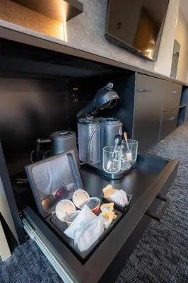 a table with food and other items on it at Everwild Canmore Hotel in Canmore