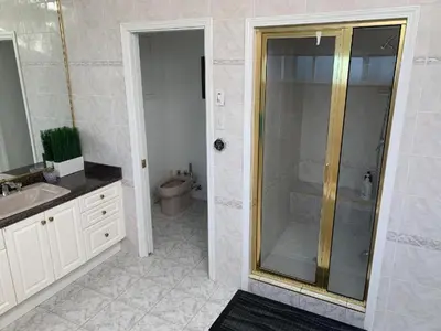 a bathroom with a shower and a toilet at Xin Xin House in Richmond