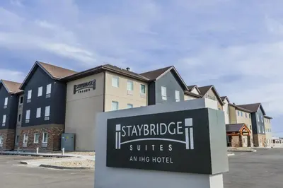 a sign in front of a building at Staybridge Suites - Dawson Creek by IHG in Dawson Creek