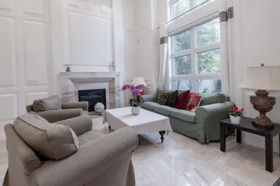a living room with two couches and a fireplace at Luxurious Private Rooms in Richmond in Richmond