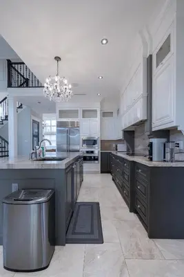 a large kitchen with white cabinets and stainless steel appliances at Luxurious Private Rooms in Richmond in Richmond