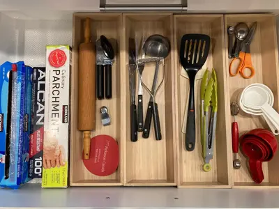 a drawer filled with utensils on top of a counter at Bright poolside walkout two bedroom basement suite in the Okanagan in Penticton