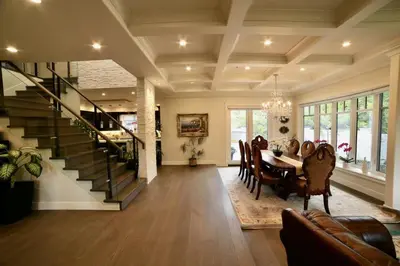 a dining room with a dining table and a staircase at Nice home away at Vancouver near YVR in Vancouver