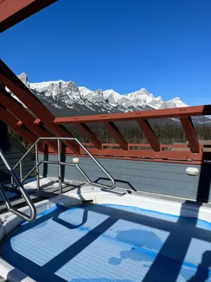 a view of the mountains from the deck of a boat at Wanna get away next Summer and Fall at the Crossing in Canmore