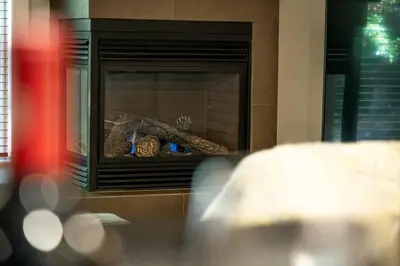 a fireplace with some food inside of it at Pacific Forest Beach House in Parksville