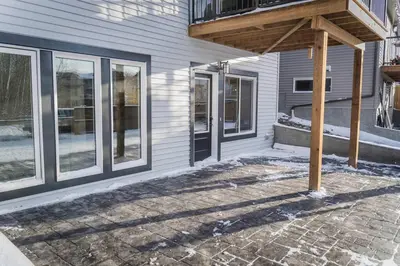 a porch of a house with a wooden awning at NYC Loft Inspired •12 mins to WEM •Vintage arcade in Edmonton