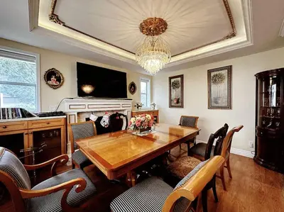 a dining room with a table and chairs and a chandelier at Super Cosy 8Bed & 6Bath in Vancouver heart near to airport and DownTown in Vancouver