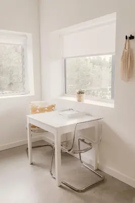 a white desk in a white room with a window at Drift West Coast Getaway in Ucluelet