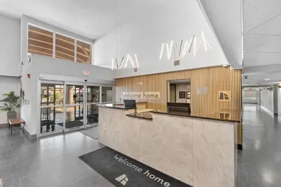 a lobby of a nursing home with a reception counter at Home Inn and Suites Lloydminster in Lloydminster