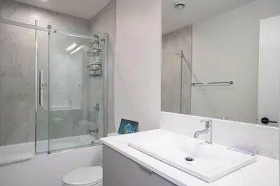 a bathroom with a sink and a shower and a toilet at Alpine Dream by Revelstoke Vacations in Revelstoke