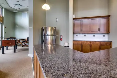 a kitchen with a granite counter top in a room at Luxury Getaway at Copper Sky 104 in West Kelowna