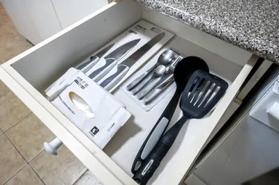 a drawer filled with kitchen utensils in a counter at Luxury Delta 2BD Suit on ground floor in Delta