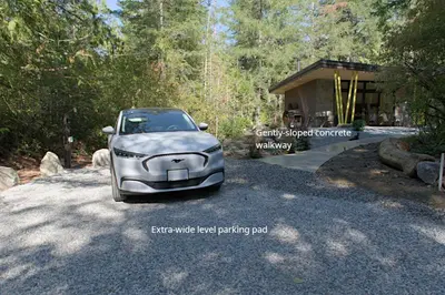 a silver car parked in front of a house at The Shed at Moon Dance in Madeira Park